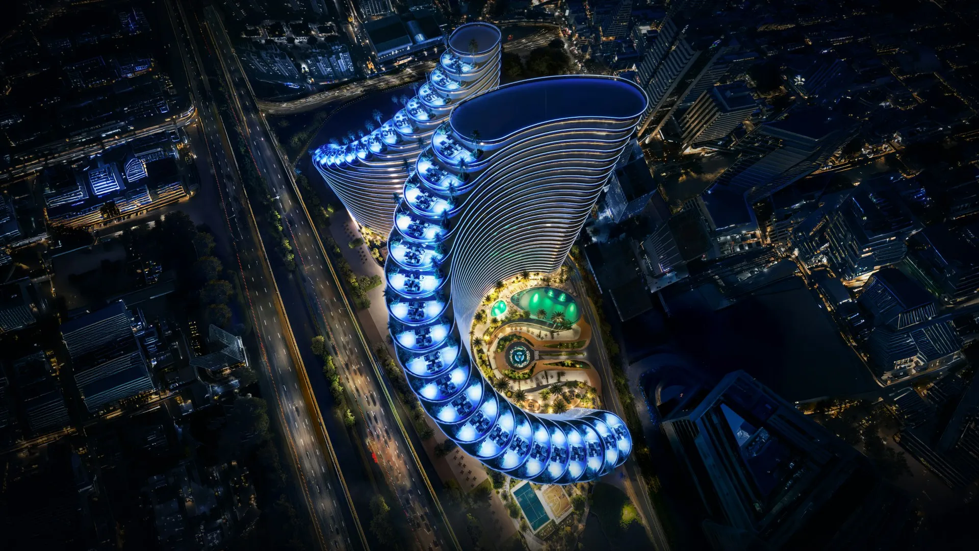 Aerial night render of Binghatti Skyflame and its curved towers