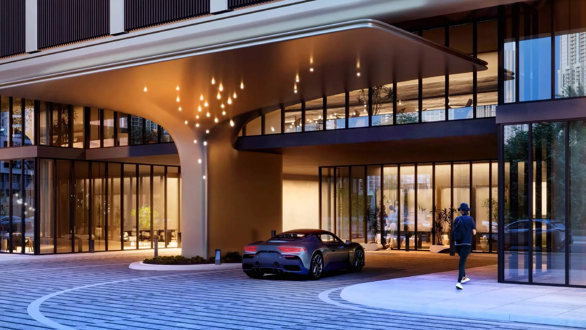 Covered arrival drop-off and lobby entrance at DWTN Residences