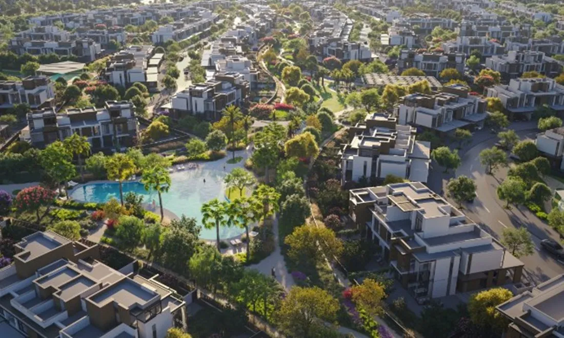 Aerial render of La Tilia townhouse clusters around the community lagoon pool