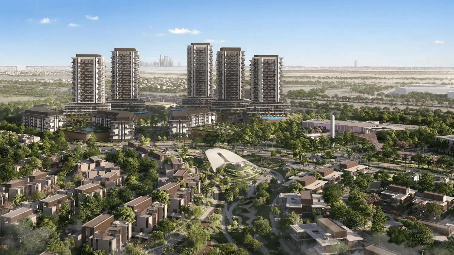 Aerial render of the Rise by Athlon towers above Athlon's villas, with the Dubai skyline on the horizon