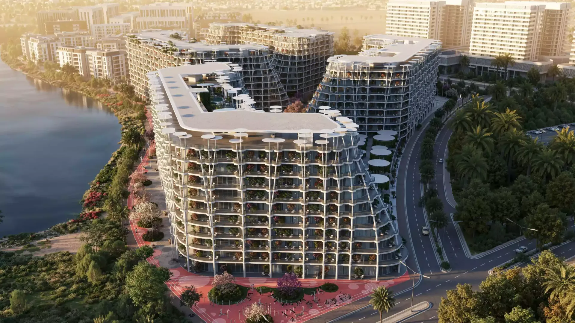 Render of a Sakura Gardens building beside the lagoon with a tree-lined walking path