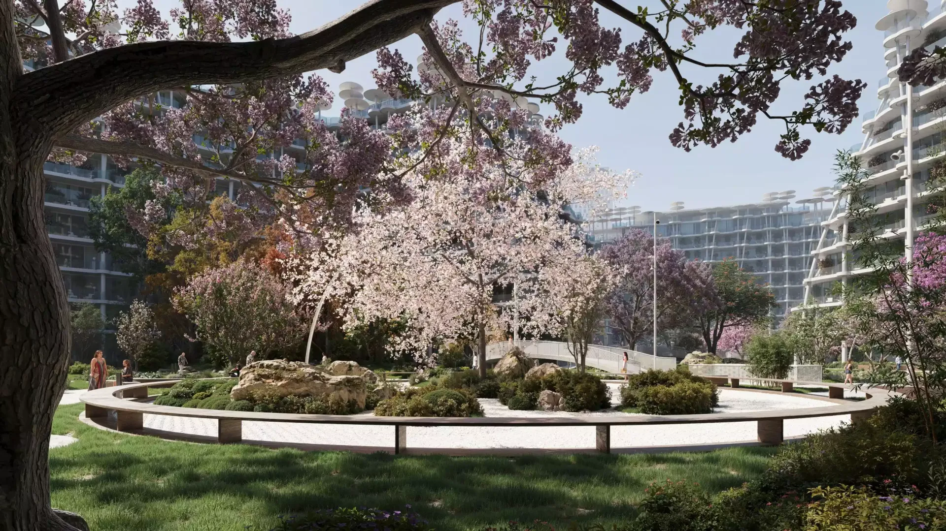 Render of a central lawn with cherry blossom trees between Sakura Gardens buildings