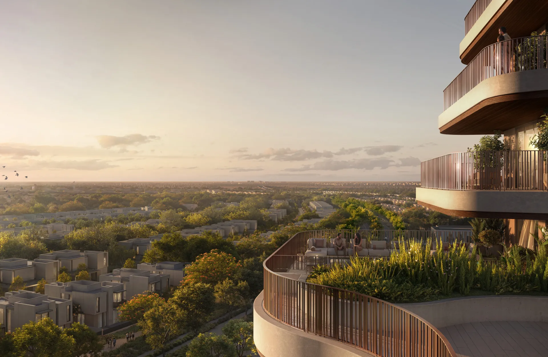Render of a curved balcony looking over The Wilds' tree canopy at sunset