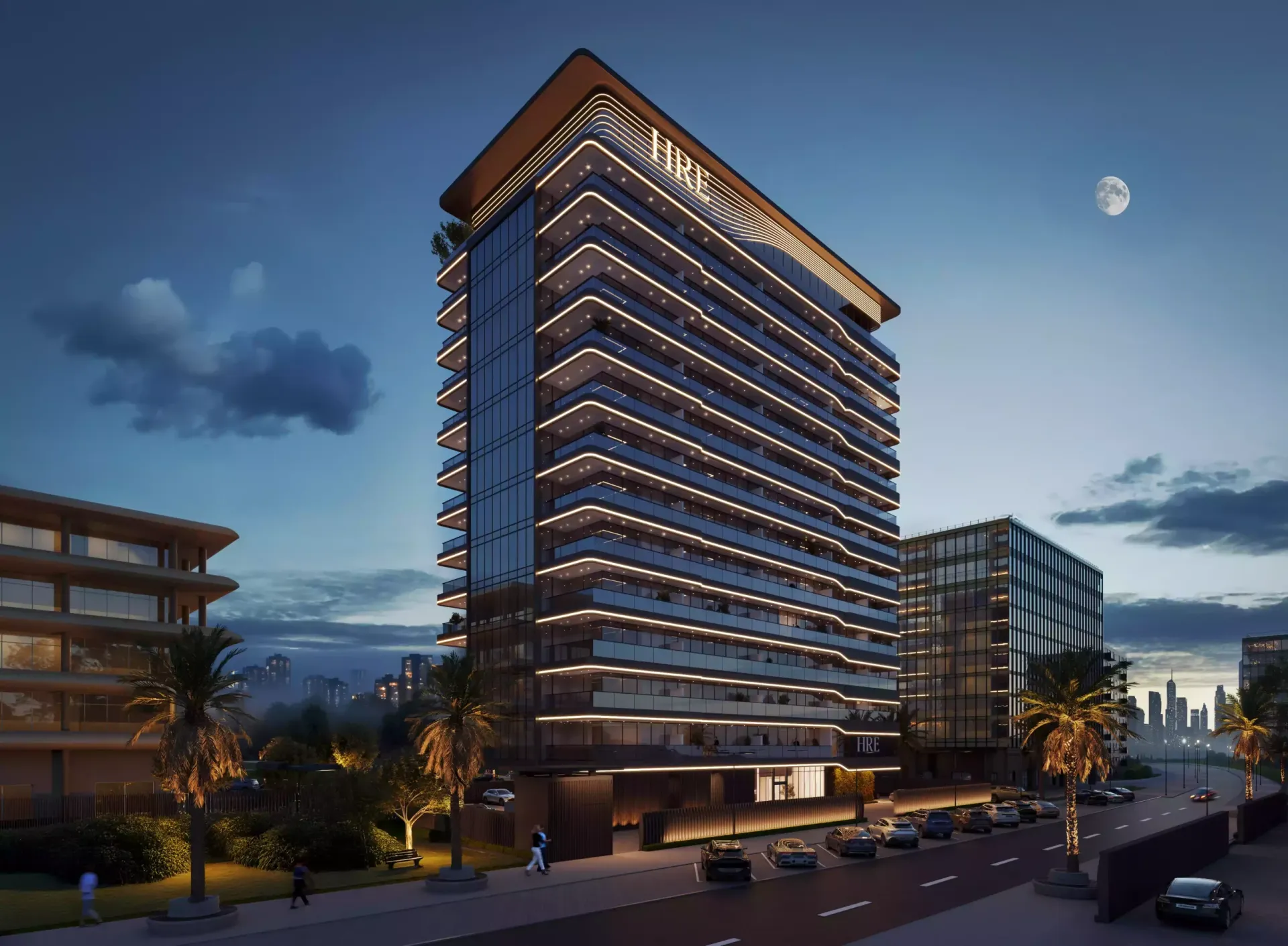 Night render of the Wadi Hills tower facade with lit balconies